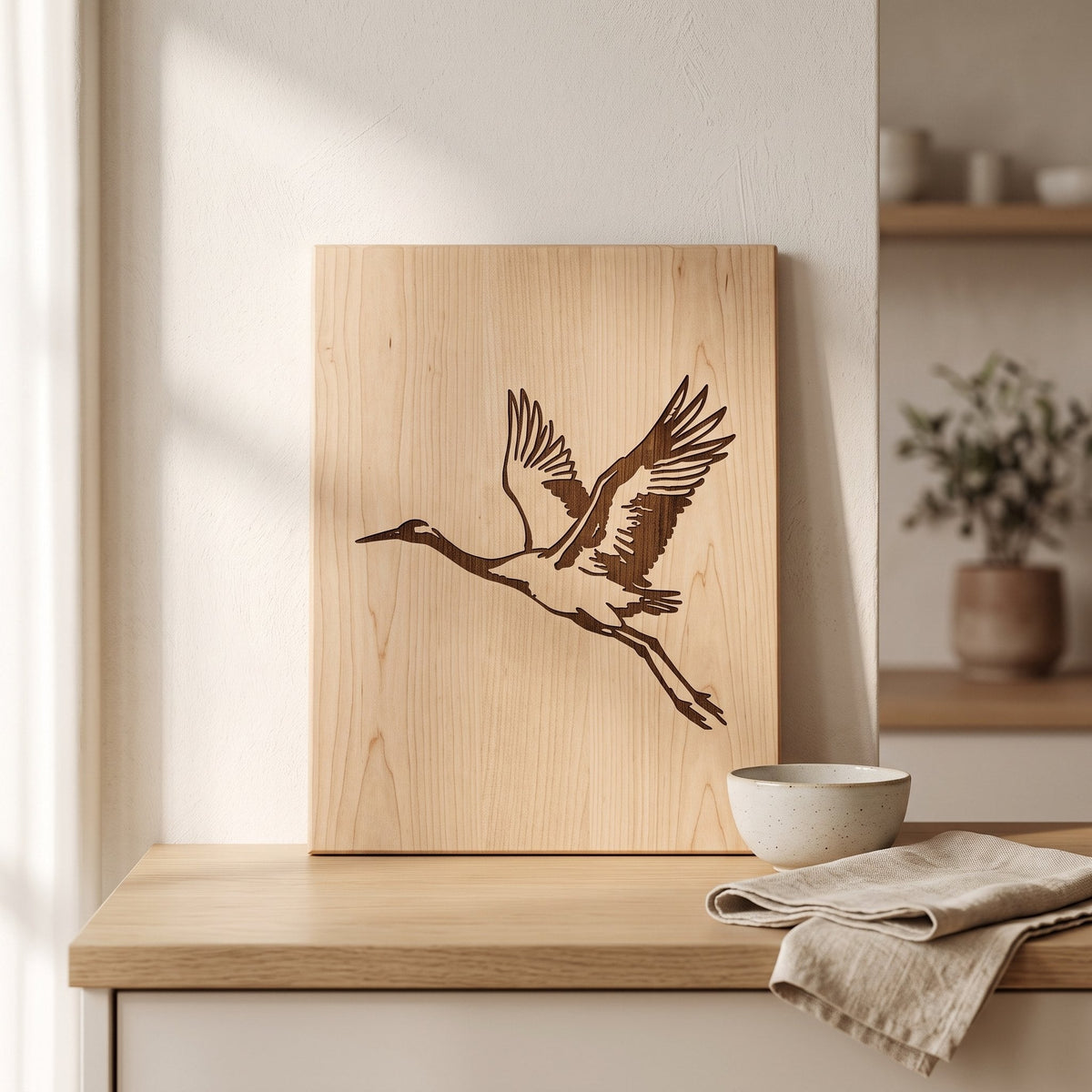 The Crane Engraved Wooden Board on a Japandi kitchen counter — Engraved Wooden Board by Calm & Oak