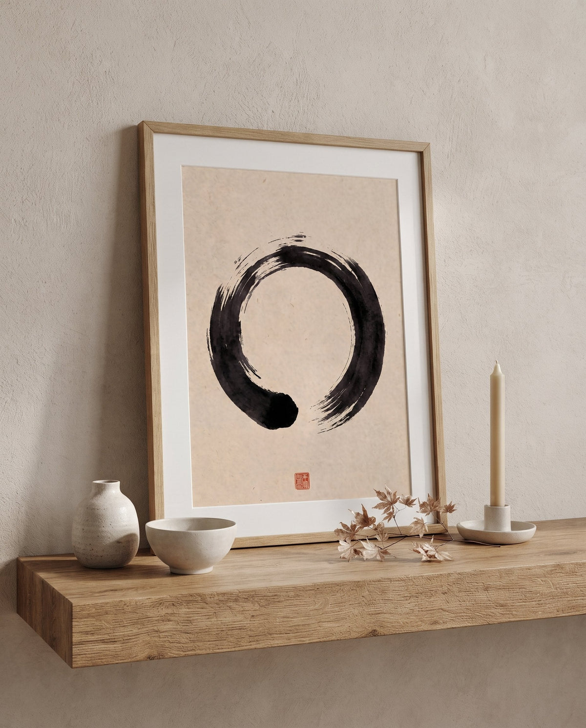 Ensō print leaning on an oak shelf